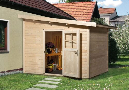 A small garden shed with flat or sloped roof. A little path made of single stones leads up to the entrance of the garden shed with a single door.